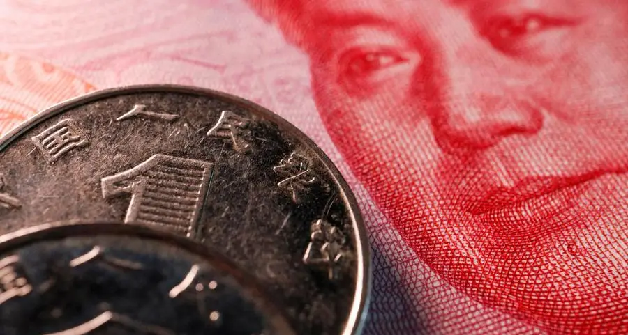 China's yuan slips on rising pre-holiday dollar demand