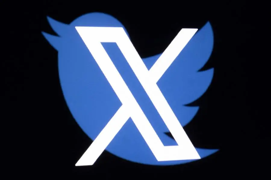 This illustration photo shows the new Twitter logo rebranded as X, and the old Twitter bird logo reflected in smartphone screens, in Paris on July 27, 2023. (Photo by JOEL SAGET / AFP) , Agence France-Presse (AFP)/AFP