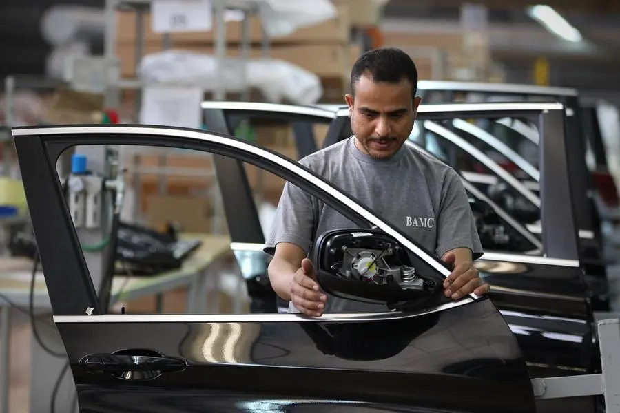 An Egyptian worker assembles car doors at a BMW factory on May 29, 2011 in 6th October City, Egypt. (Photo by Peter Macdiarmid/Getty Images) Image used for illustrative purpose. , Getty Images