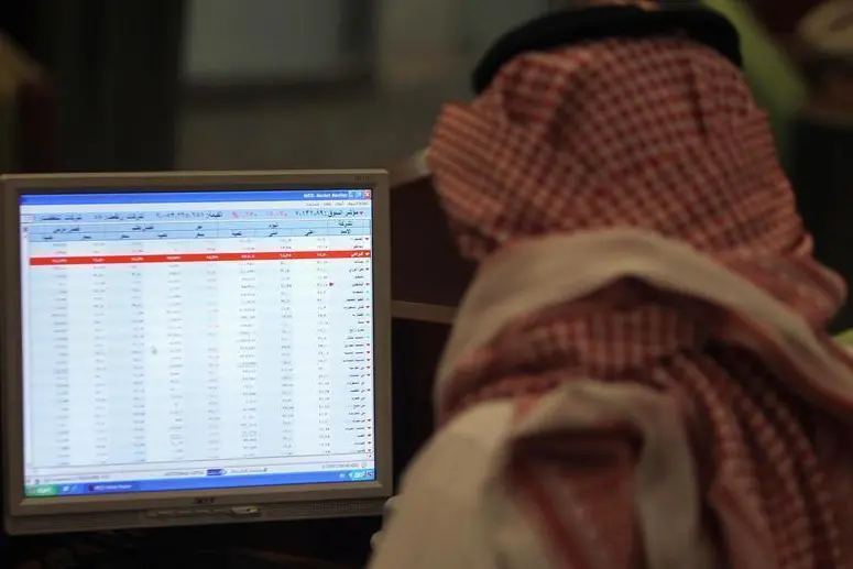 A Saudi trader monitors stocks at the Saudi Stock Exchange in Riyadh. FAISAL NASSER, Reuters