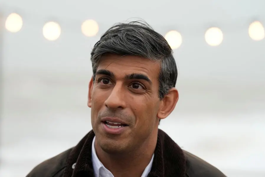 British Prime Minister Rishi Sunak speaks to a TV reporter during his visit to Clacton-on-Sea, Britain, Wednesday, Oct. 18, 2023. Frank Augstein/Pool via REUTERS\\u2028