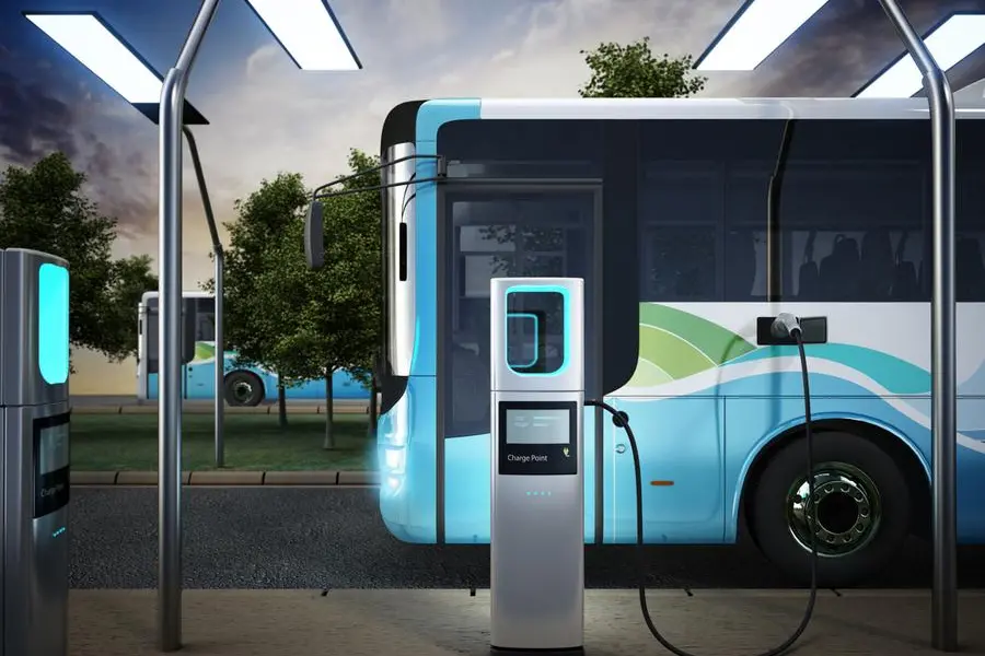 Electric city bus recharging at the bus charge station, connected with a power cable. Getty Images Image used for illustrative purpose