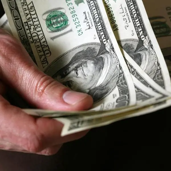 Dollar hits one-month low against euro before US data, falls vs yen