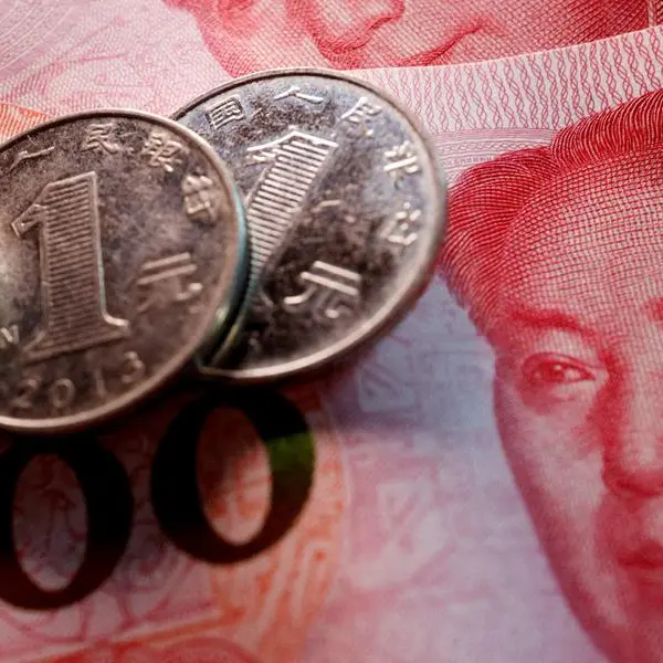 China's yuan falls, tracks yen slide after BOJ decision