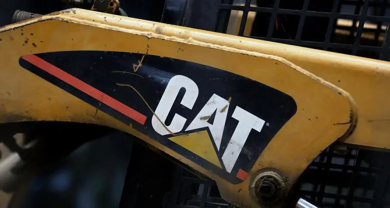 Caterpillar profit slides as costs and forex squeeze margins, shares down\n