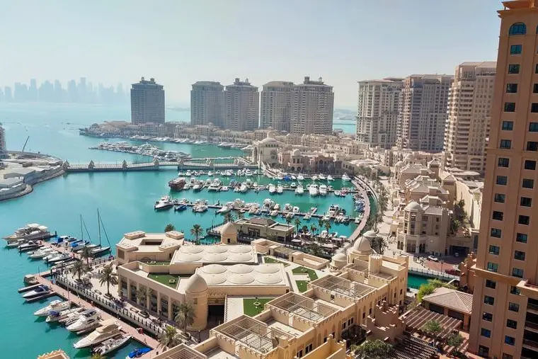 High angle view of buildings by sea against sky,Doha,Qatar - stock photo. Image Courtesy: Getty Images , Getty Images/500px