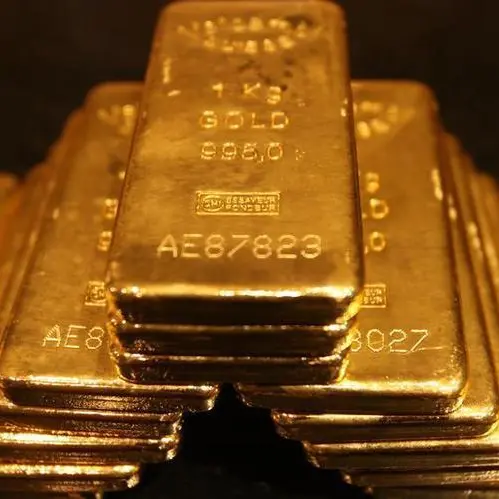Gold hovers near 3-week low as traders await Powell's remarks