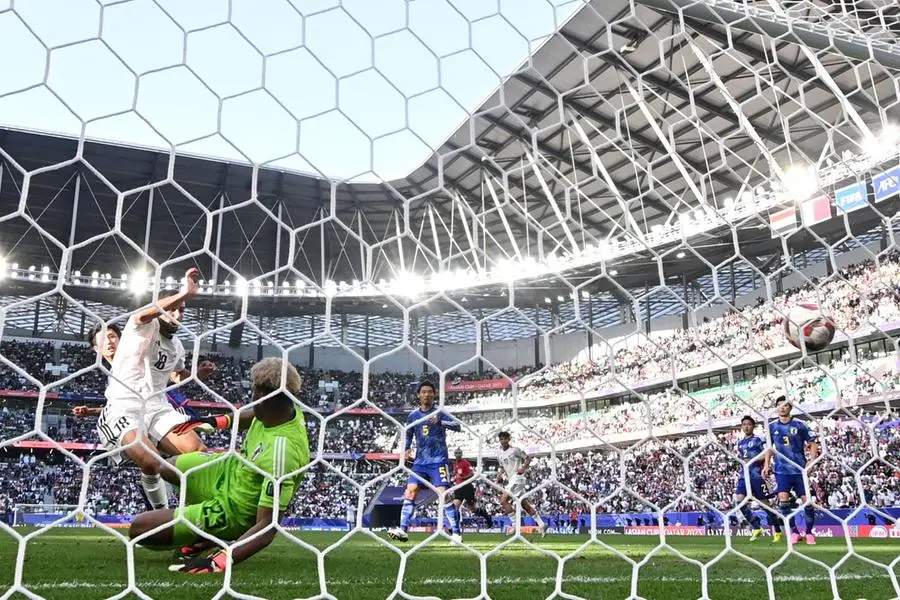 Japan\\'s goalkeeper #23 Zion Suzuki concedes the second goal by Iraq\\'s forward #18 Aymen Hussein during the Qatar 2023 AFC Asian Cup Group D football match between Iraq and Japan at the Education City Stadium in Al-Rayyan, west of Doha on January 19, 2024. (Photo by HECTOR RETAMAL / AFP) , Agence France-Presse (AFP)/AFP