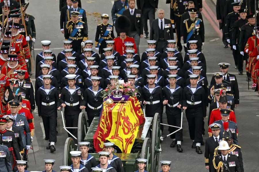 Pictured: The State Gun Carriage, which was pulled by 142 Naval Ratings carrying the coffin of Her Majesty Queen Elizabeth II moves along the Procession route, up Constitution Hill. Behind the coffin can be seen, from left to right: HRH King Charles III, HRH Prince William, The Prince of Wales, HRH Princess Anne, HRH The Duke of Sussex, HRH Prince Andrew and HRH Prince Edward. The UK Armed Forces have played a part in the procession for Her Majesty The Queen’s funeral and committal service today, in London and Windsor. Marking the end to 10 days of proceedings, service personnel representing a variety of regiments, ships and air stations that held a special relationship with Her Majesty The Queen took part in the funeral processions in London and Windsor. Around 4,000 regular and reserve soldiers, sailors, marines and aviators, as well as musicians from Armed Forces bands, took part in the proceedings today. This included over 3,000 military personnel in central London, with 1,650 personnel forming part of the procession from the Palace of Westminster to Westminster Abbey and procession from Westminster Abbey to Wellington Arch. In Windsor, over 1,000 military personnel were involved in ceremonial activity, including 410 taking part in the procession from Albert Road, Windsor, to St George’s Chapel, Windsor Castle. Cpl Tim Hammond/Pool via REUTERS