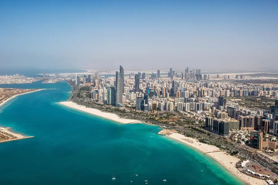Abu Dhabi, UAE with surrounding area viewed from helicopter. Many details are visible in the image. Abu Dhabi participates in Abu Dhabi Sustainability Week as a main sponsor. . Image Courtesy: Getty Images