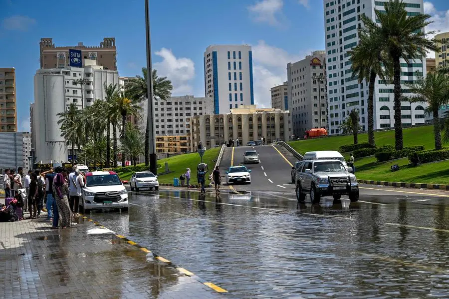 A picture shows a flooded street following heavy rains in Sharjah on April 17, 2024. Dubai, the Middle East's financial centre, has been paralysed by the torrential rain that caused floods across the UAE and Bahrain and left 18 dead in Oman on April 14 and 15. (Photo by Ahmed RAMAZAN / AFP)