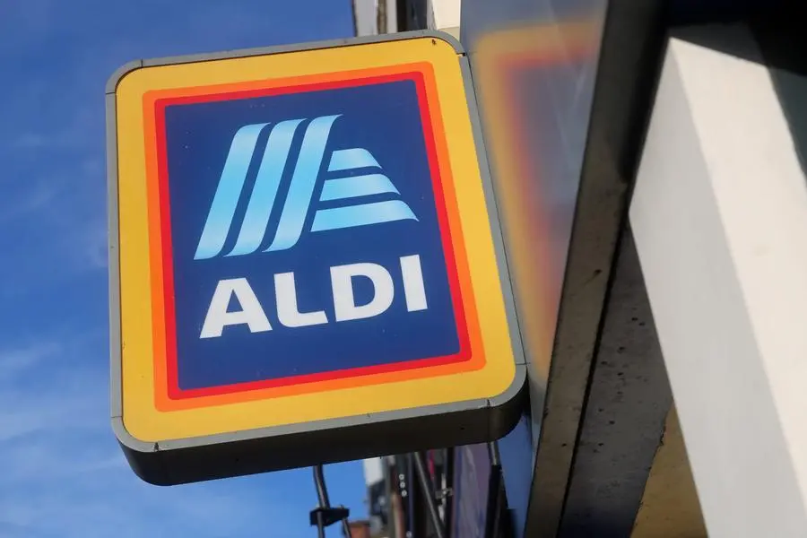 Signage is pictured outside an Aldi Local store on Kilburn High Road in London on January 2, 2023. (Photo by ISABEL INFANTES / AFP)
