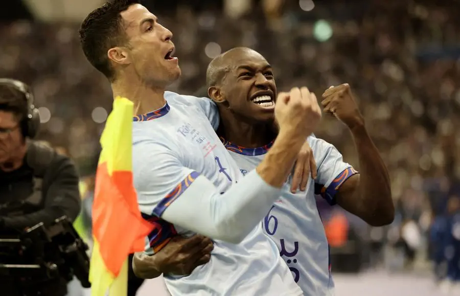 Soccer Football - Friendly - Saudi Pro League XI v Paris St Germain - King Fahd International Stadium, Riyadh, Saudia Arabia - January 19, 2023 Saudi Pro League XI's Cristiano Ronaldo celebrates scoring their second goal with Saud Abdulhamid REUTERS/Ahmed Yosri