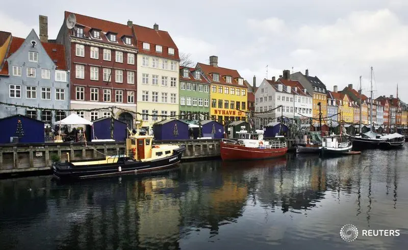 Boats are seen anchored at the 17th century Nyhavn district, home to many shops and restaurants in Copenhagen, Denmark. REUTERS/Bob Strong Image for illustrative purpose.