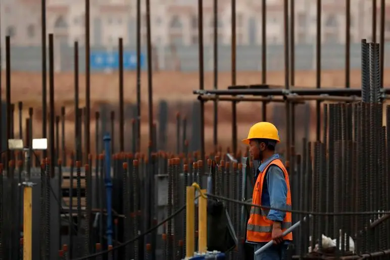 Image used for illustrative purpose. A Chinese construction labourer works at the site of Iconic Tower skyscraper, at its foundations in the business district, being built by China State Construction Engineering Corp (CSCEC) in the New Administrative Capital (NAC) east of Cairo, Egypt May 2, 2019. Picture taken May 2, 2019. Image used for illustrative purpose. , Reuters Images/Amr Abdallah Dalsh