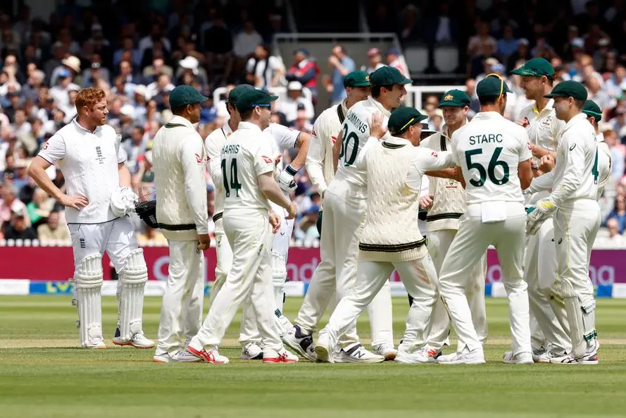 England\\'s Jonny Bairstow (L) reacts as Australia celebrate his wicket, following a review, on day five of the second Ashes cricket Test match between England and Australia at Lord\\'s cricket ground in London on July 2, 2023. (Photo by Ian Kington / AFP)