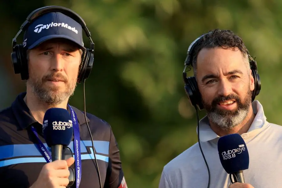 DUBAI, UNITED ARAB EMIRATES - NOVEMBER 19: Robbie Greenfield of England (L) working as an on course commentator with Zane Scotland of England for Dubai Eye Radio during the third round on Day Three of the DP World Tour Championship on the Earth Course at Jumeirah Golf Estates on November 19, 2022 in Dubai, United Arab Emirates. Image Courtesy: David Cannon/Getty Images