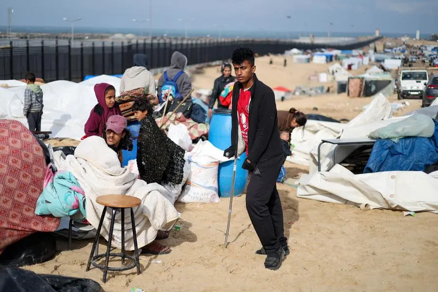 People rest as Palestinians fleeing Khan Younis due to the Israeli ground operation arrive in Rafah, amid the ongoing conflict between Israel and the Palestinian Islamist group Hamas, in the southern Gaza Strip, January 26, 2024. REUTERS/Ibraheem Abu Mustafa , Reuters