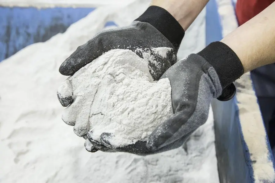 An employee holds silica sand, the base material for making 3-D printing molds, at a facility in Germany. Photographer: Martin Leissl/Bloomberg. Image used for illustrative purpose. Gerry Images