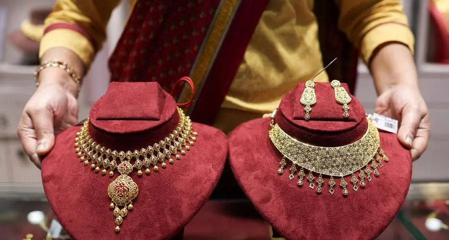 Gold briefly dips below $5,000 as Fed speculation drives sharp pullback