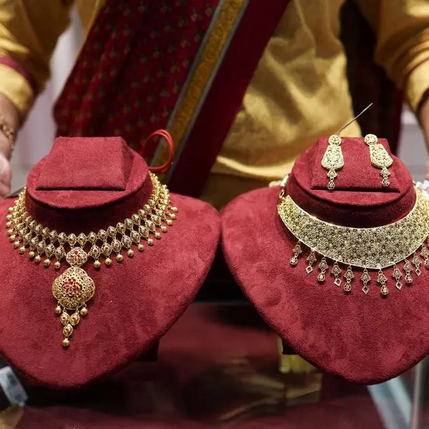 Gold eases on firmer dollar as investors await clarity on US-Iran talks