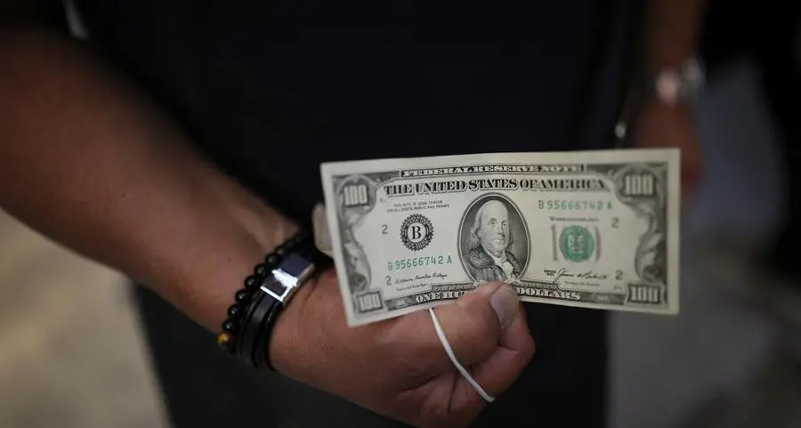 Dollar drifts higher at end of volatile week of Trump backflips