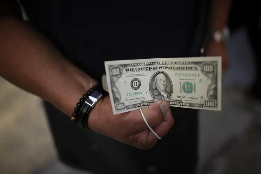 Dollar on back foot ahead of payrolls data even as trade talks go on