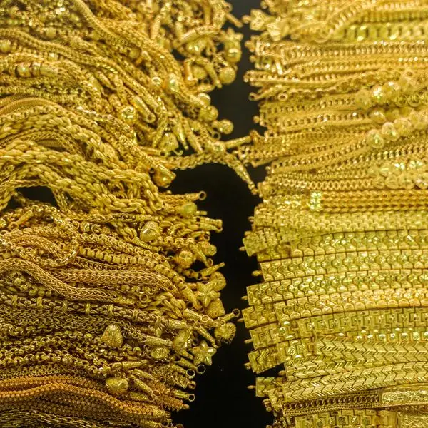 Gold hits record high as traders bet on US rate cuts, eye Powell's signal