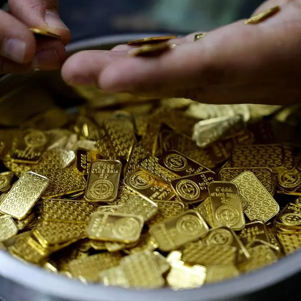 Gold turns positive as oil eases on hopes for Iran talks