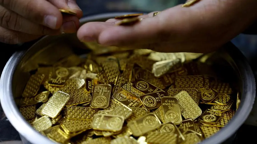Gold turns positive as oil eases on hopes for Iran talks