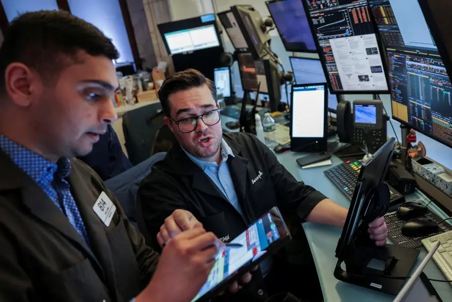 Traders work on the floor at the New York Stock Exchange (NYSE) in New York City, U.S., June 25, 2025. REUTERS/Jeenah Moon. , Reuters