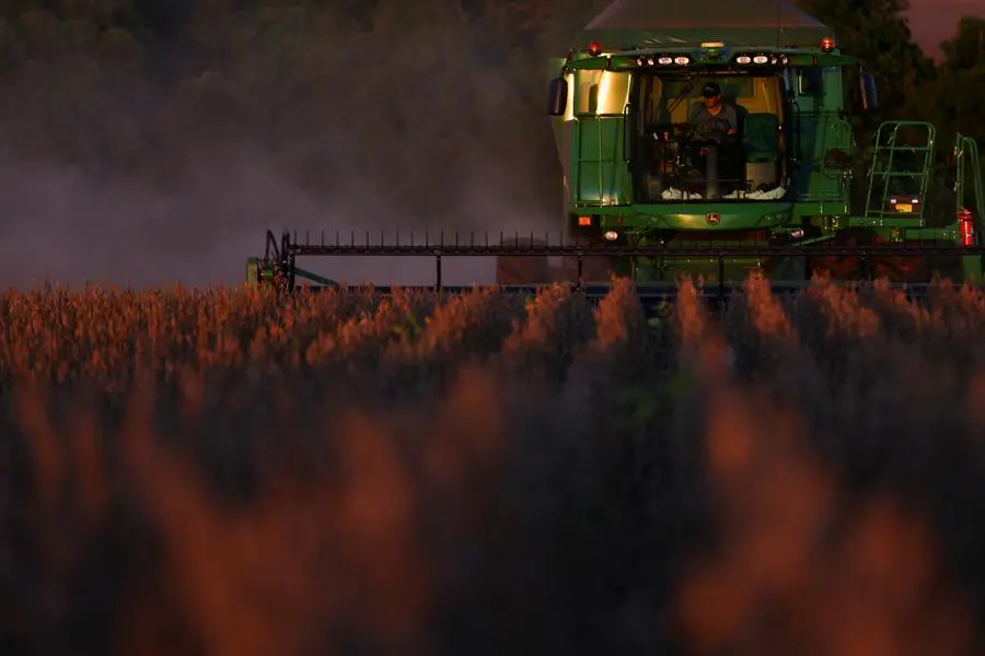 A farm worker operates a combine harvester during the soybean harvest season in Brazil\\'s southernmost state, on a farm in Nao Me Toque, Rio Grande do Sul state, Brazil, April 4, 2025. REUTERS/Diego Vara. , Reuters