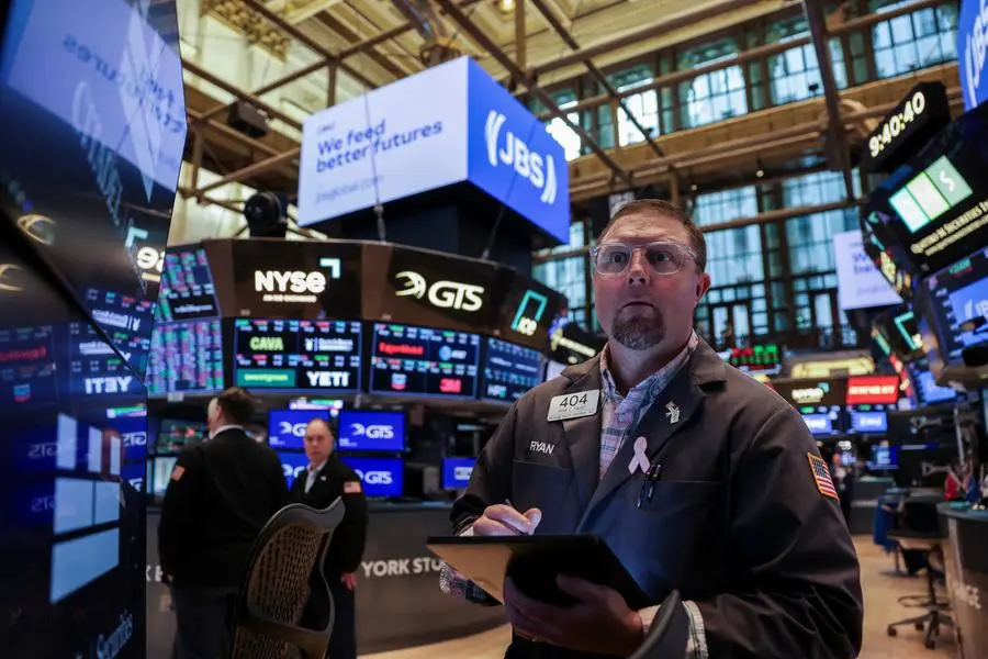 Traders work on the floor at the New York Stock Exchange (NYSE) in New York City, U.S., June 25, 2025. REUTERS/Jeenah Moon. , Reuters