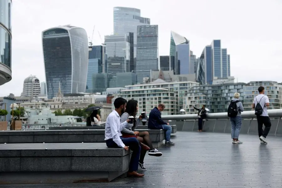 FILE PHOTO: People drink takeaway coffee in view of the City of London skyline in London, Britain, July 25, 2024. REUTERS/Hollie Adams. , Reuters
