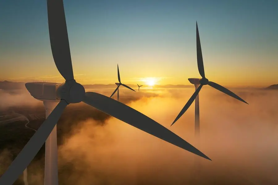 Wind turbine silhouette at sunrise, wind energy and nature concept. Image used for illustrative purpose. Image courtesy: Getty Images/ Piyaset , Getty Images