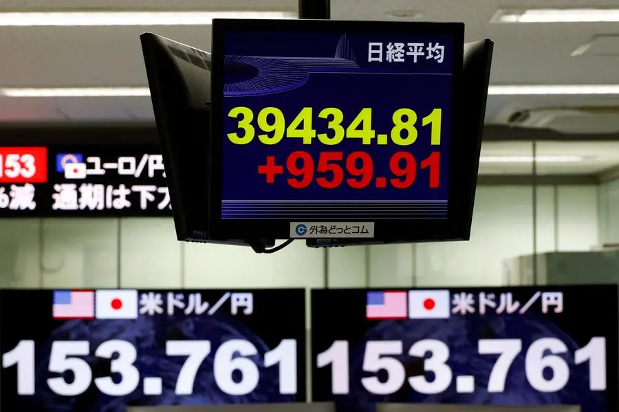 A monitor displaying the Nikkei stock average is seen in front of monitors displaying the Japanese yen exchange rate against the U.S. dollar at a dealing room of he foreign exchange trading company Gaitame.com in Tokyo, Japan November 6, 2024. REUTERS/Kim Kyung-Hoon. , Reuters