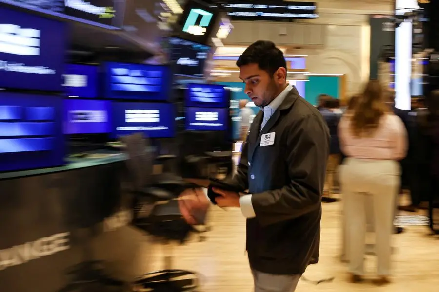 Traders work on the floor at the New York Stock Exchange (NYSE) in New York City, U.S., June 18, 2025. REUTERS/Brendan McDermid. , Reuters