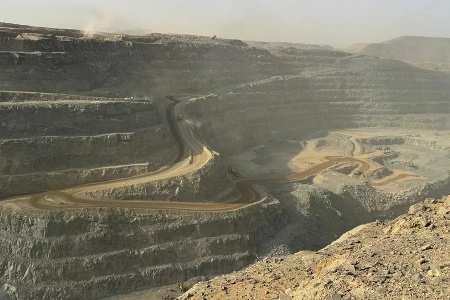 Ore trucks in an open-pit mine. Saudi Arabia largest gold mine, Largest Open pit mines in the Saudi Arabia, Heavy machinery working in the gold mines. Image used for illustrative purpose. Getty Images , Getty Images