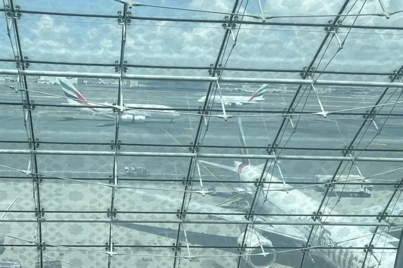 FILE PHOTO: Emirates Airlines planes are seen on the runway before take off at the Dubai International Airport, in Dubai, United Arab Emirates, April 17, 2024. REUTERS/Ahmed Jadallah. , Reuters