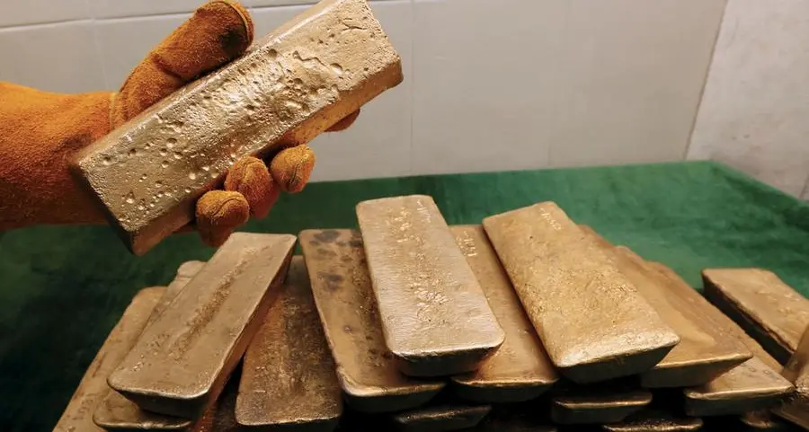 Gold hovers near record high ahead of US inflation data