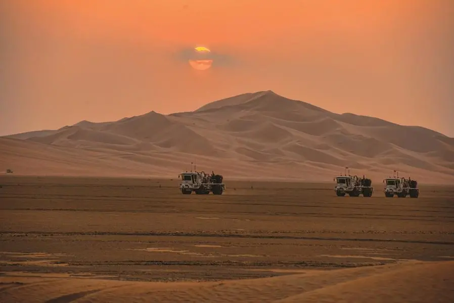 FILE PHOTO: Saudi Aramco\\'s truck are seen during exploration in the Empty Quarter, Saudi Arabia November 18, 2013. Picture taken November 18, 2013. Saudi Aramco/Handout via REUTERS ATTENTION EDITORS - THIS PICTURE WAS PROVIDED BY A THIRD PARTY./File Photo , Reuters/REUTERS