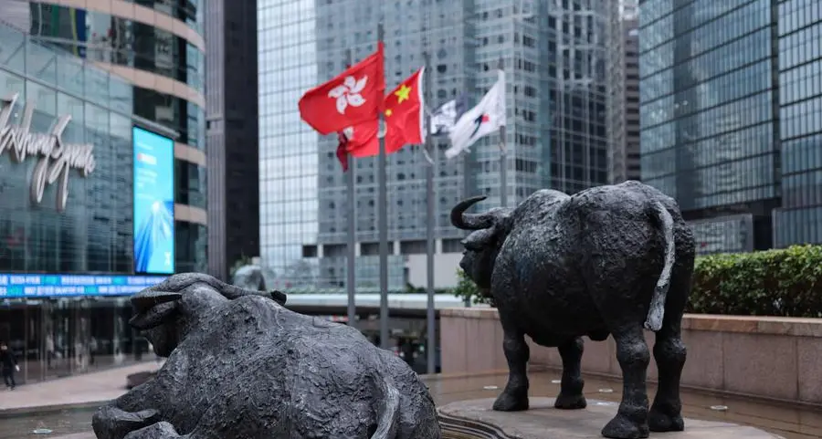 Shares edge higher in Asia as oil dips, earnings loom