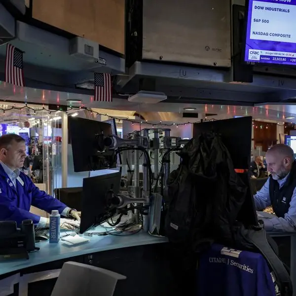 Stocks climb, oil volatile as investors assess Venezuela implications