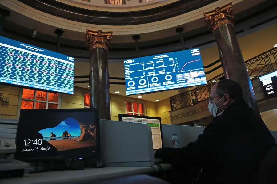 CAIRO, EGYPT - DECEMBER 23: A stockbroker watches the share prices on a screen at the Egyptian stock exchange amid the spread of the coronavirus on December 23, 2020 in Cairo, Egypt. Photo by Fadel Dawod/Getty Images). Image used for illustrative purpose. Getty Images , Getty Images