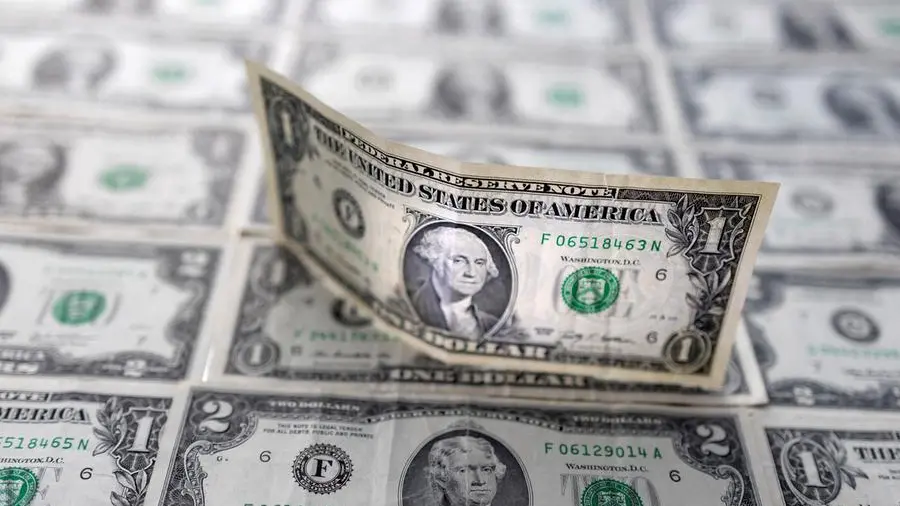 Dollar holds gains on economic data, Fed bets