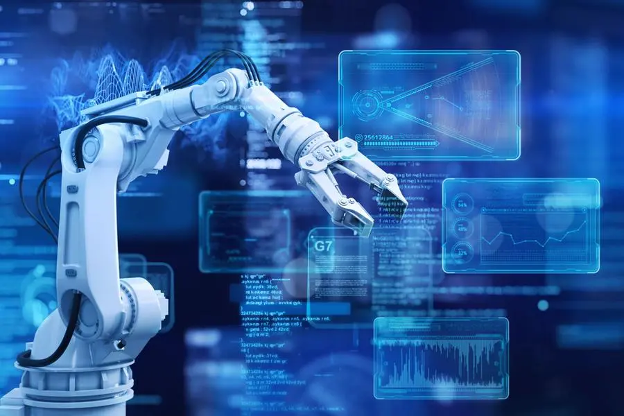 Robot arm and a futuristic graphical user interface screen on dark blue background. Image used for illustrative purpose. Image courtesy: Getty Images/ Yuichiro Chino , Getty Images