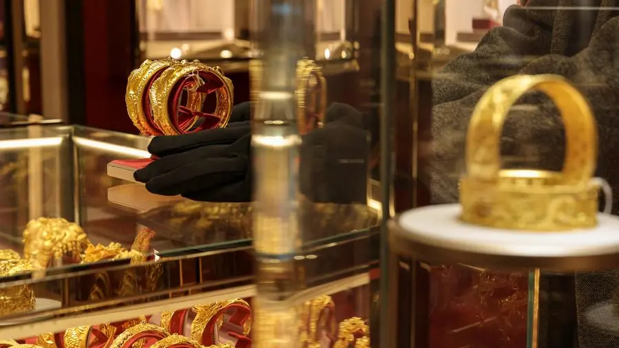 Gold extends gains on softer dollar; investors eye US jobs data