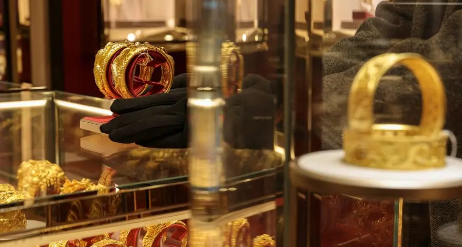 Gold climbs more than 2% on softer dollar, easing fears of higher interest rates