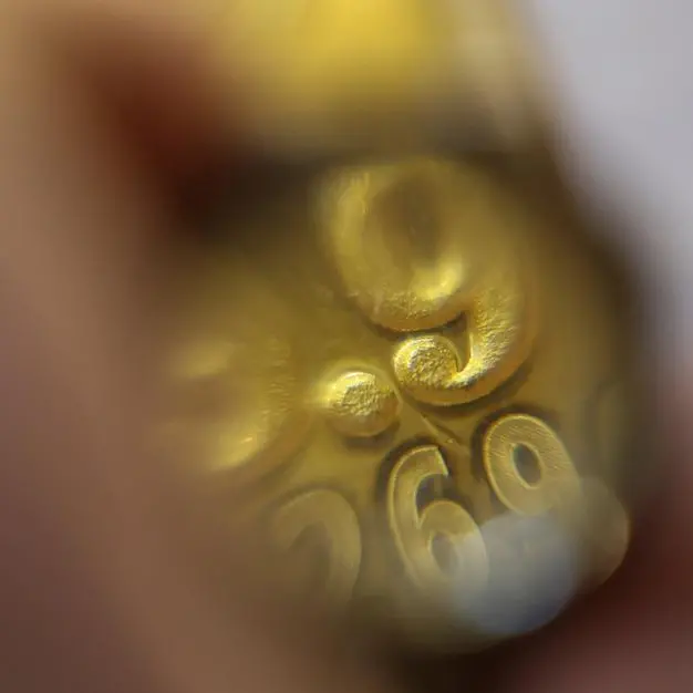 Gold slips on stronger dollar, oil as markets await Trump decision on Iran proposal