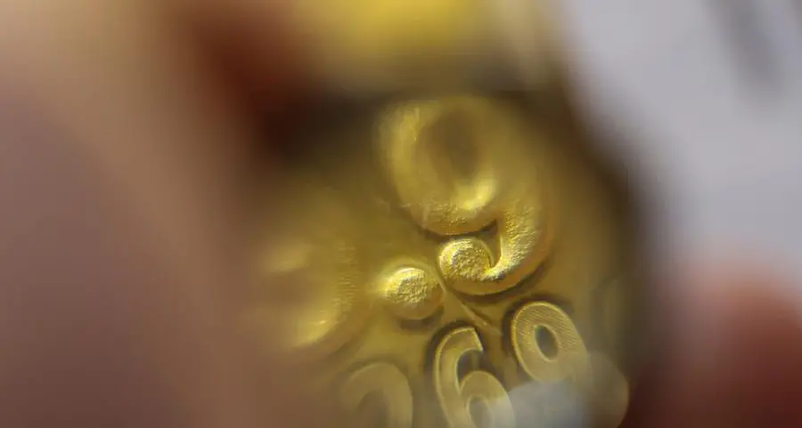 Gold slips on stronger dollar, oil as markets await Trump decision on Iran proposal